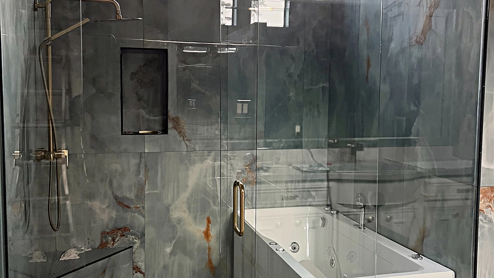 Renovated bathroom interior highlighting carefully selected fixtures, finishes, and spatial planning by Bager Remodeling