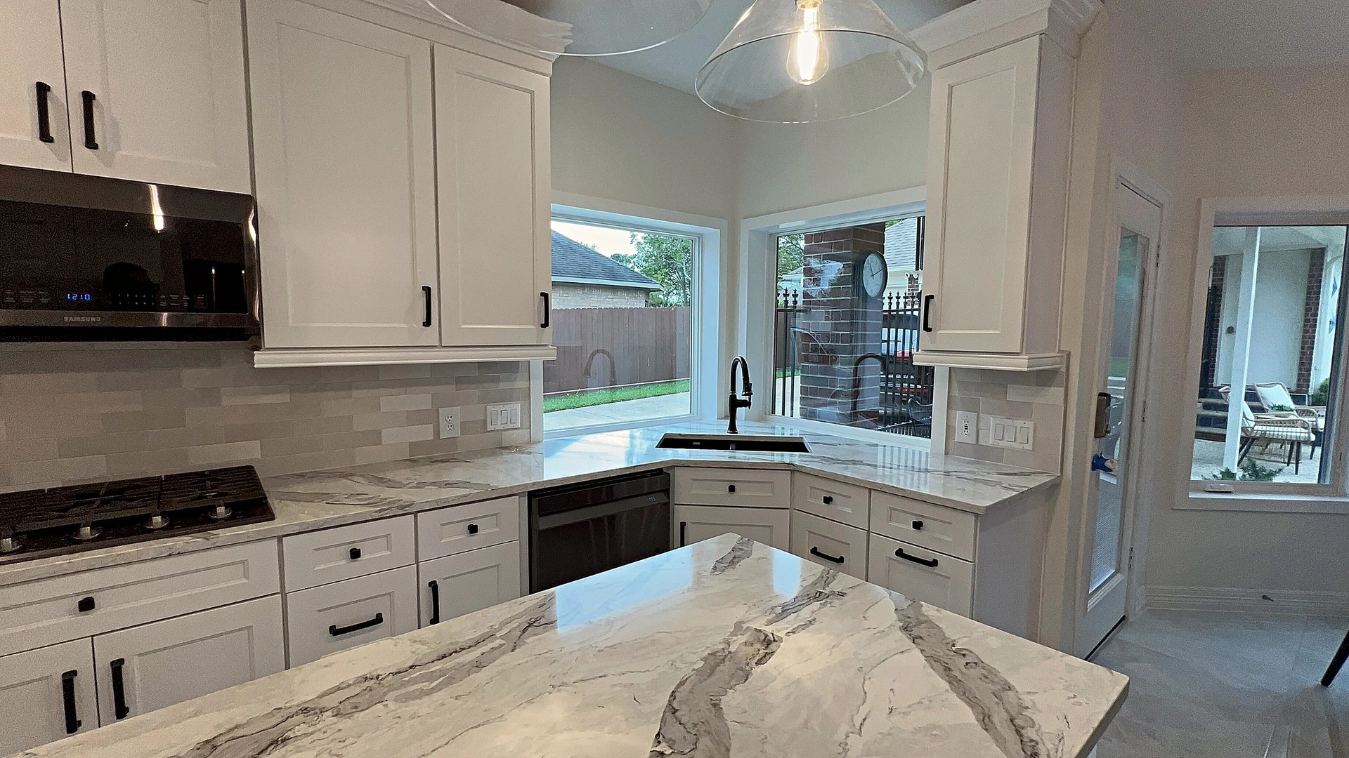 Custom cabinetry and refined finishes in a fully redesigned kitchen, designed and built in-house by Bager Remodeling in Houst